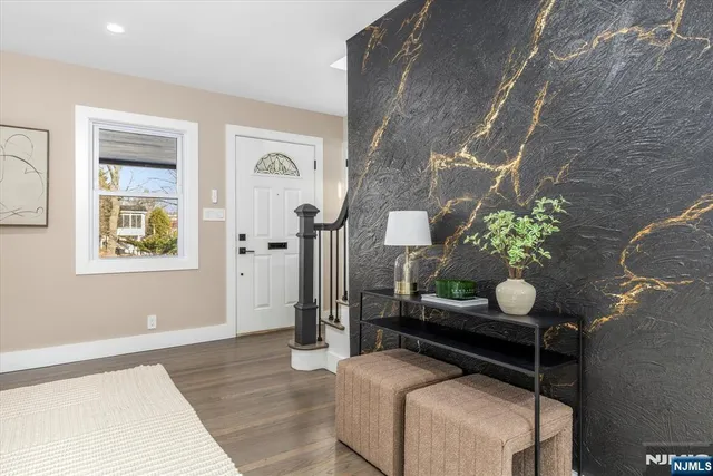 a living room with furniture and flowers