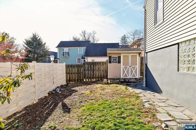 a view of a house with a yard and garage