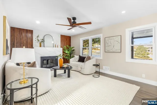 a living room with furniture and a fireplace