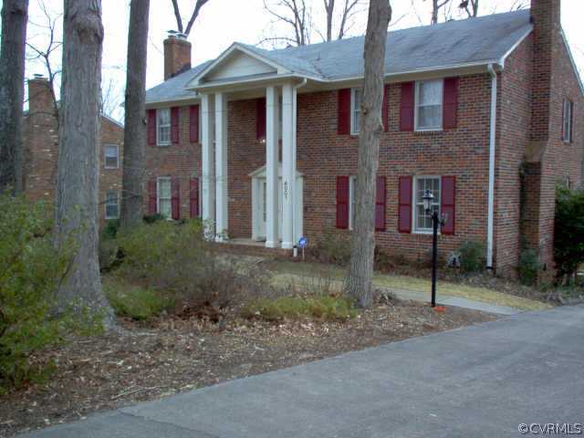 4001 Cresthill Road Chester, VA 23831 - Photo 1 of 1 a view of a brick house next to a yard