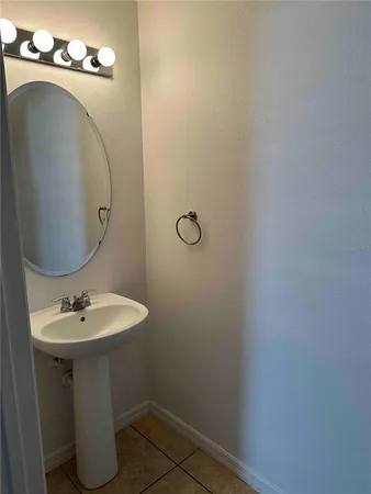 a bathroom with a sink and mirror