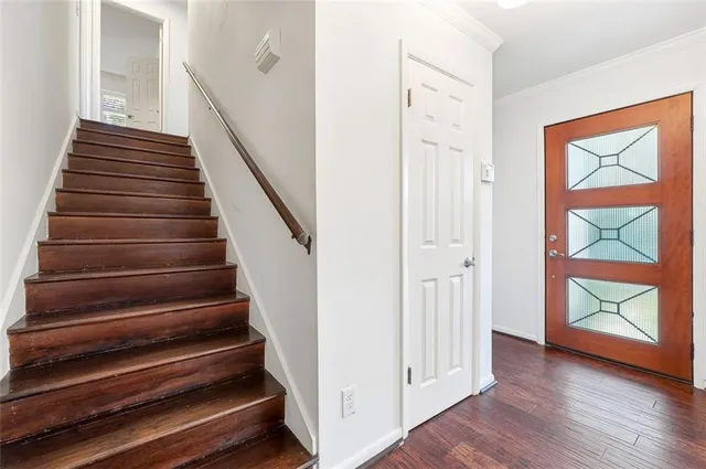 a view of an entryway with wooden floor