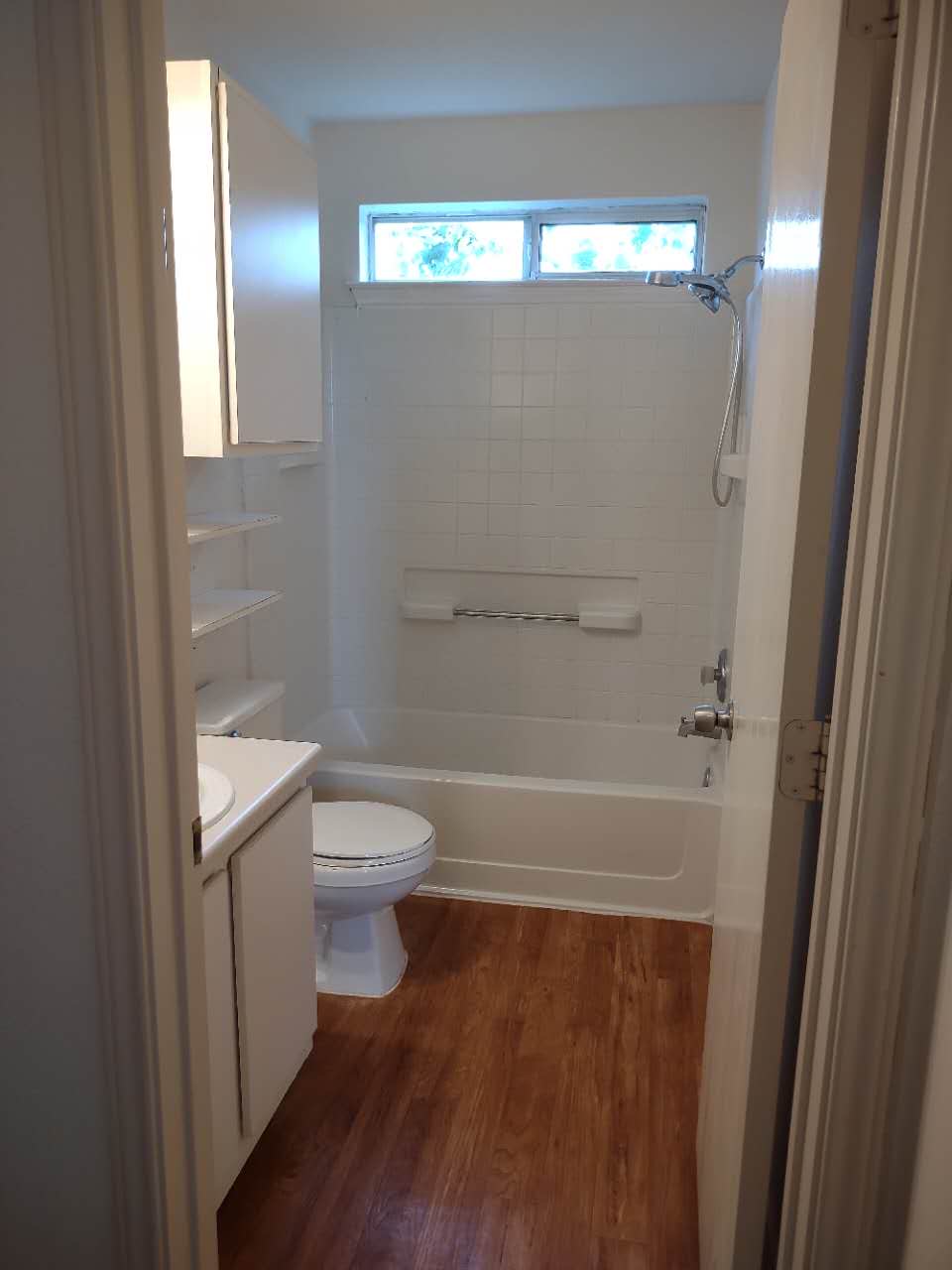 11709 Briarcreek Loop Manor, TX 78653 - Photo 15 of 19 A compact bathroom offers essential amenities and warm wood-look flooring.