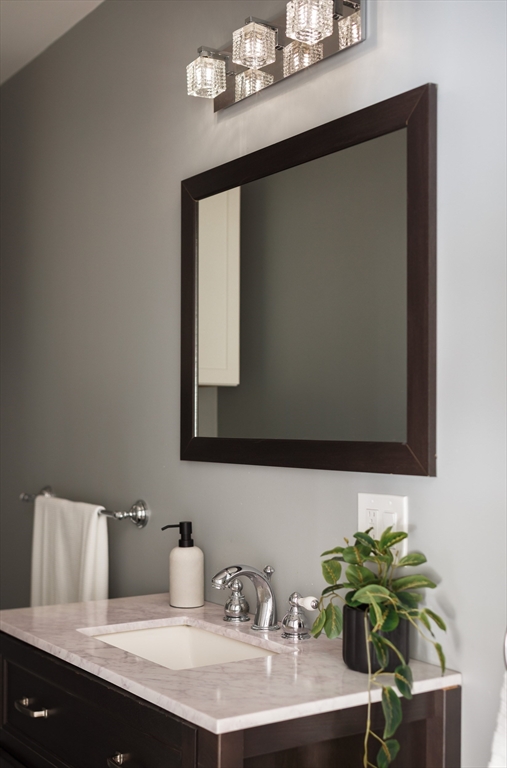 36 High Street Andover, MA 01810 - Photo 18 of 21 a bathroom with a sink and a mirror