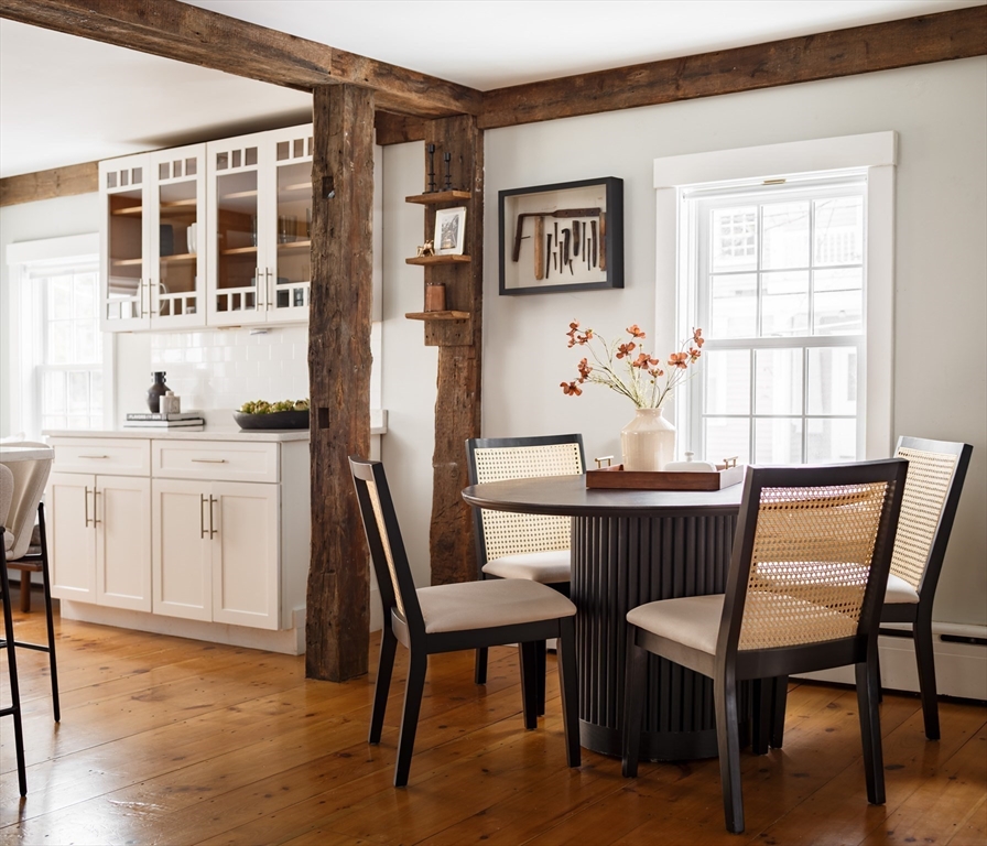 36 High Street Andover, MA 01810 - Photo 4 of 21 a dining room with a wooden table and chairs