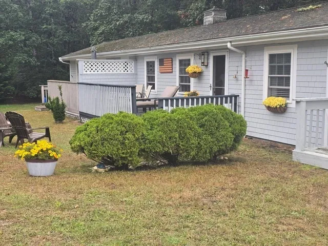 a front view of a house with garden