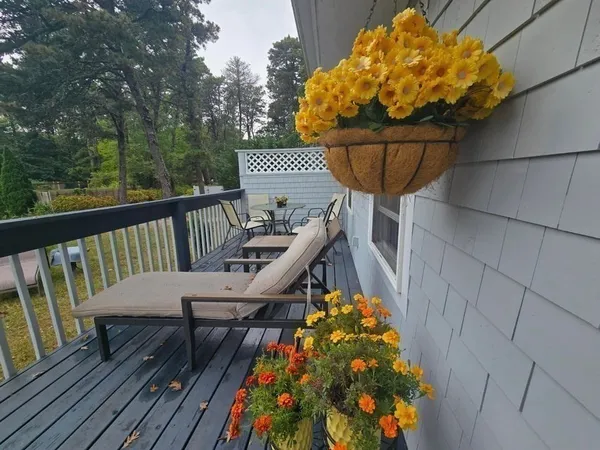 a view of balcony with wooden floor