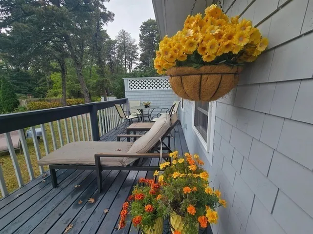 a view of balcony with wooden floor