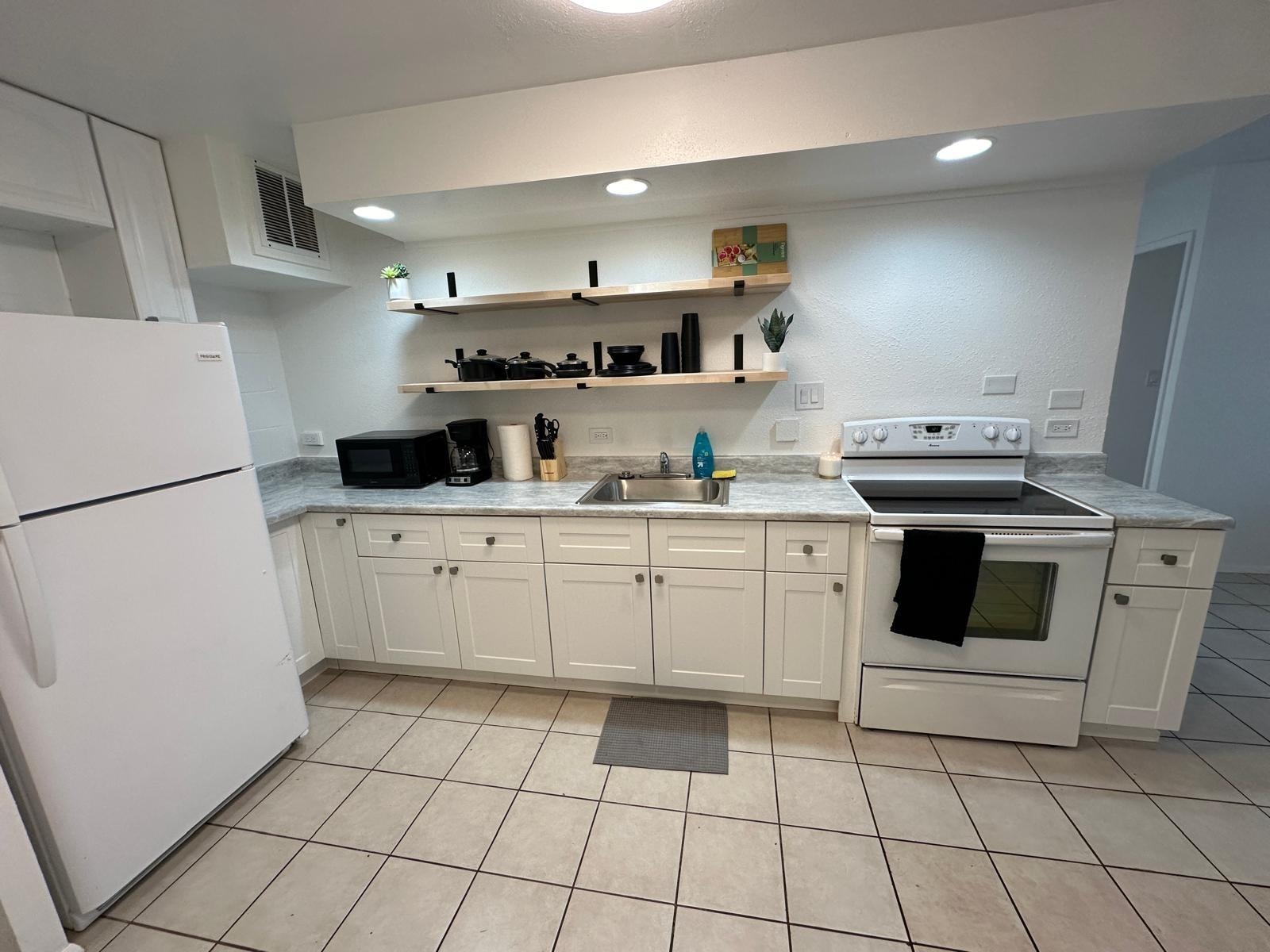 111 Kahului Beach Road, Unit C116 Kahului, HI 96732 - Photo 2 of 14 a kitchen with cabinets and appliances