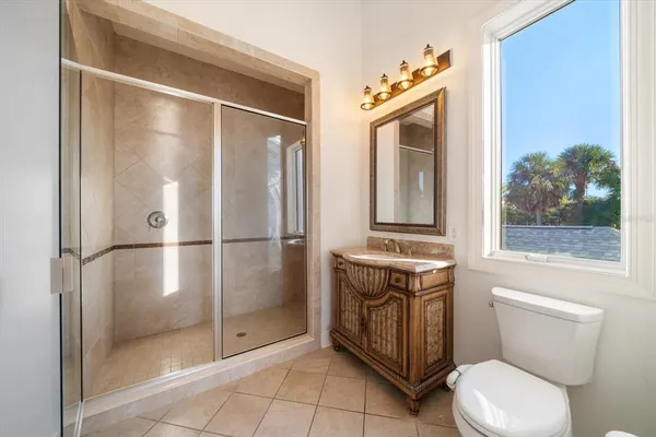 a living room with a dresser and a wooden floor