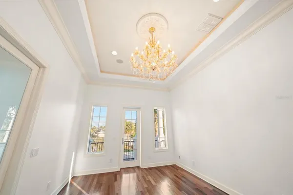 a view of hallway with wooden floor and stairs