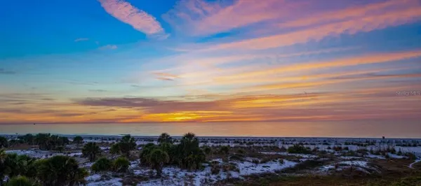 a front view of a house with a ocean view