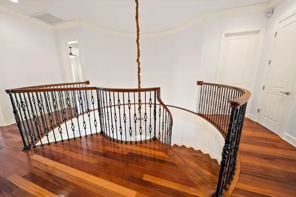 a view of a big building with an outdoor space and seating area