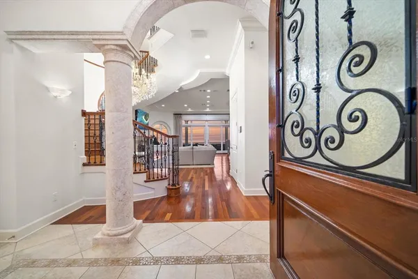 a kitchen with granite countertop kitchen island a sink stove and wooden cabinets