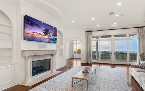 a view of a dining room with furniture and a large window