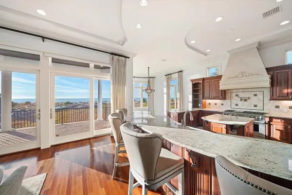 a view of a hallway with windows and stairs