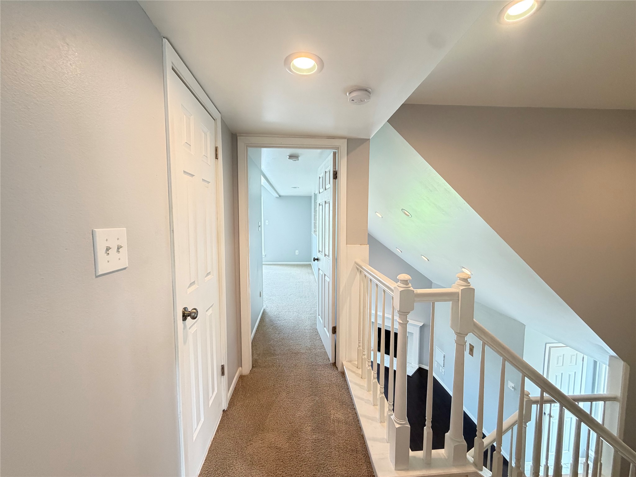 2918 Ranch Road 620 North, Unit C120 Austin, TX 78734 - Photo 14 of 34 A well-lit landing provides access to rooms and connects upper and lower levels.