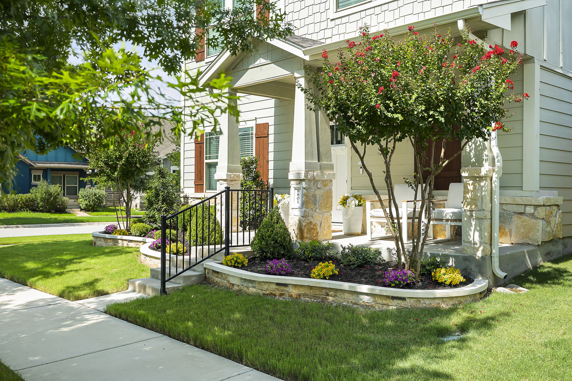 8801 Cattle Baron Path Austin, TX 78747 - Photo 1 of 1 View of side of home featuring a yard and covered porch.