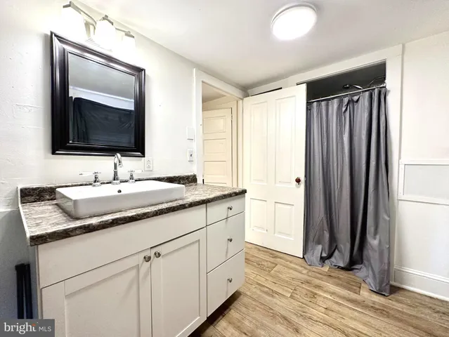 a bathroom with a double vanity sink and mirror