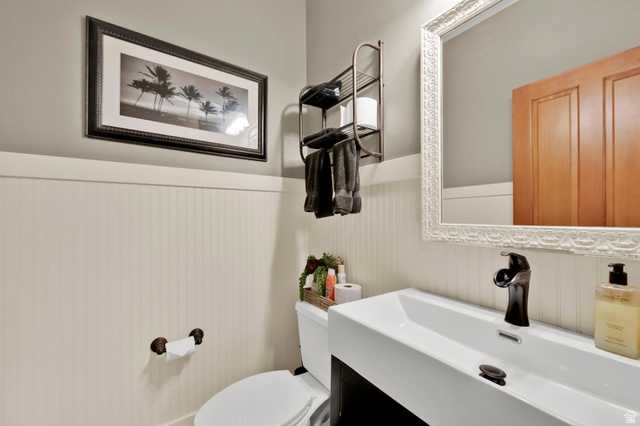 488 Mission Drive Midway, UT 84049 - Photo 21 of 35 Modern rectangular vessel sink with a dark bronze faucet, set against a backdrop of beadboard paneling