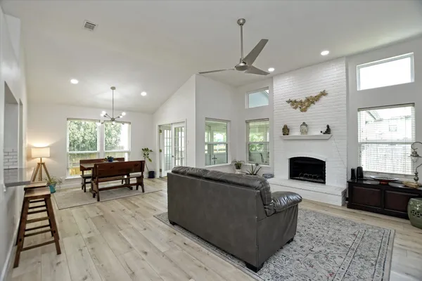 a living room with furniture fireplace and window