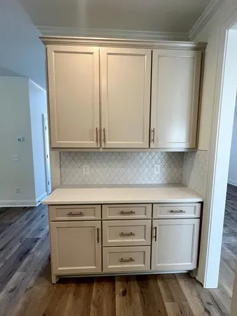 a stove top oven sitting inside of a kitchen