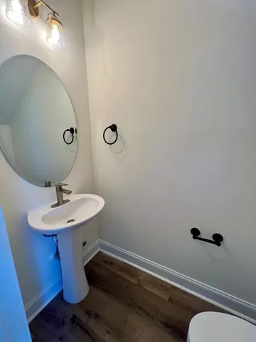 a bathroom with a sink and mirror
