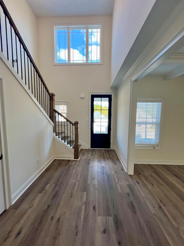 7015 Spring Walk Drive Columbus, GA 31904 - Photo 4 of 28 a view of an entryway with wooden floor and windows
