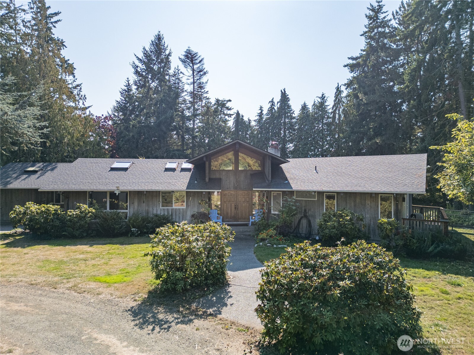 1175 Cameron Road Sequim, WA 98382 - Photo 1 of 39 a front view of a house with garden
