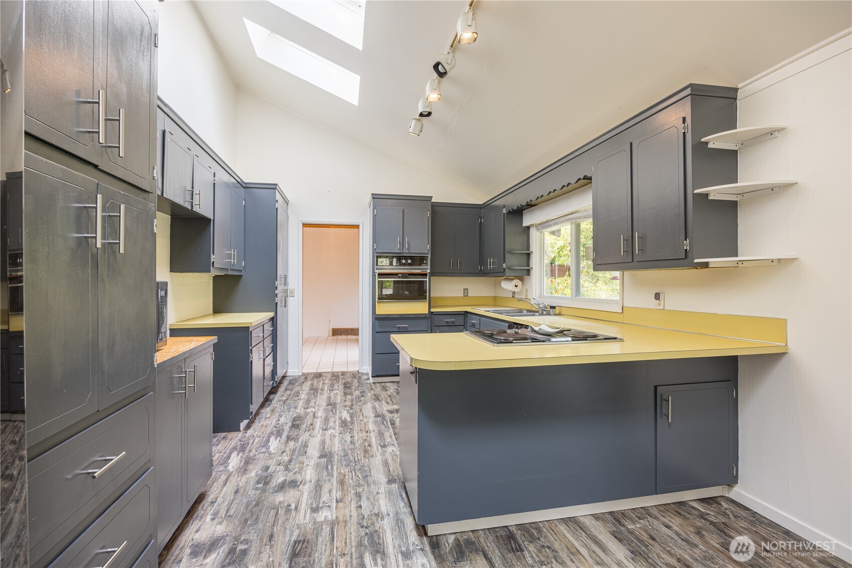 1175 Cameron Road Sequim, WA 98382 - Photo 21 of 39 a kitchen with stainless steel appliances granite countertop a sink stove and refrigerator