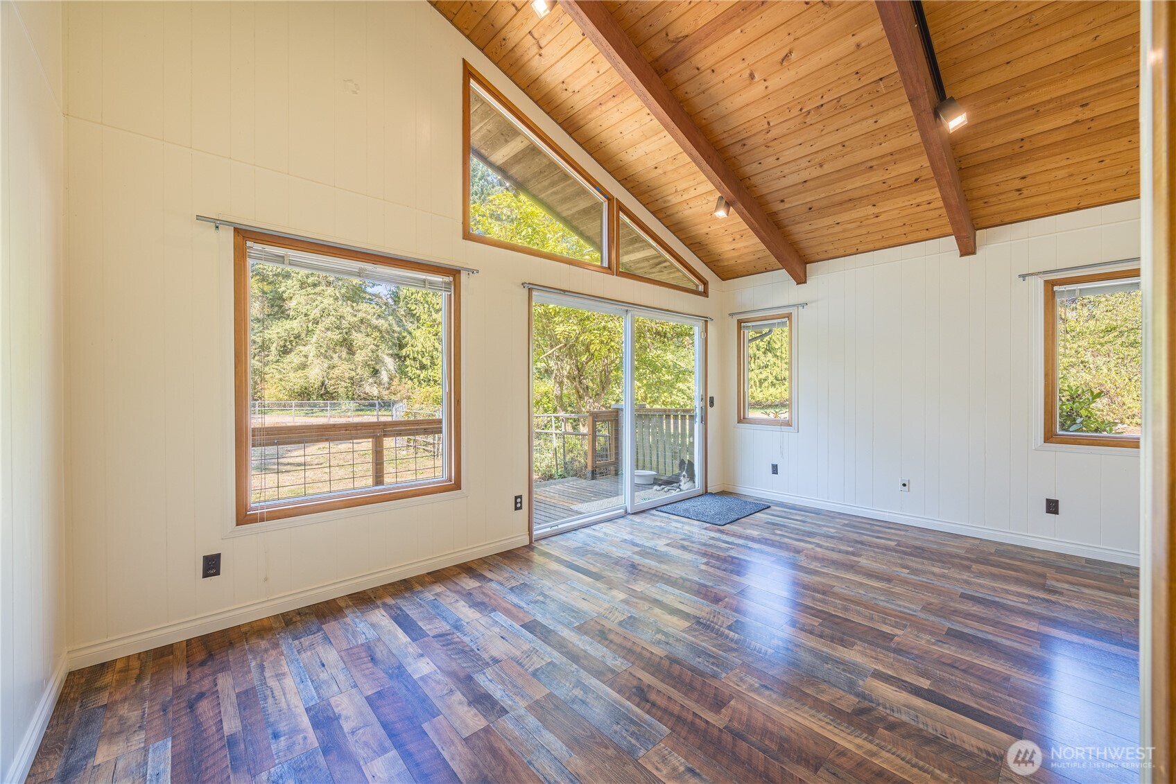 1175 Cameron Road Sequim, WA 98382 - Photo 24 of 39 a view of an empty room with wooden floor and a window