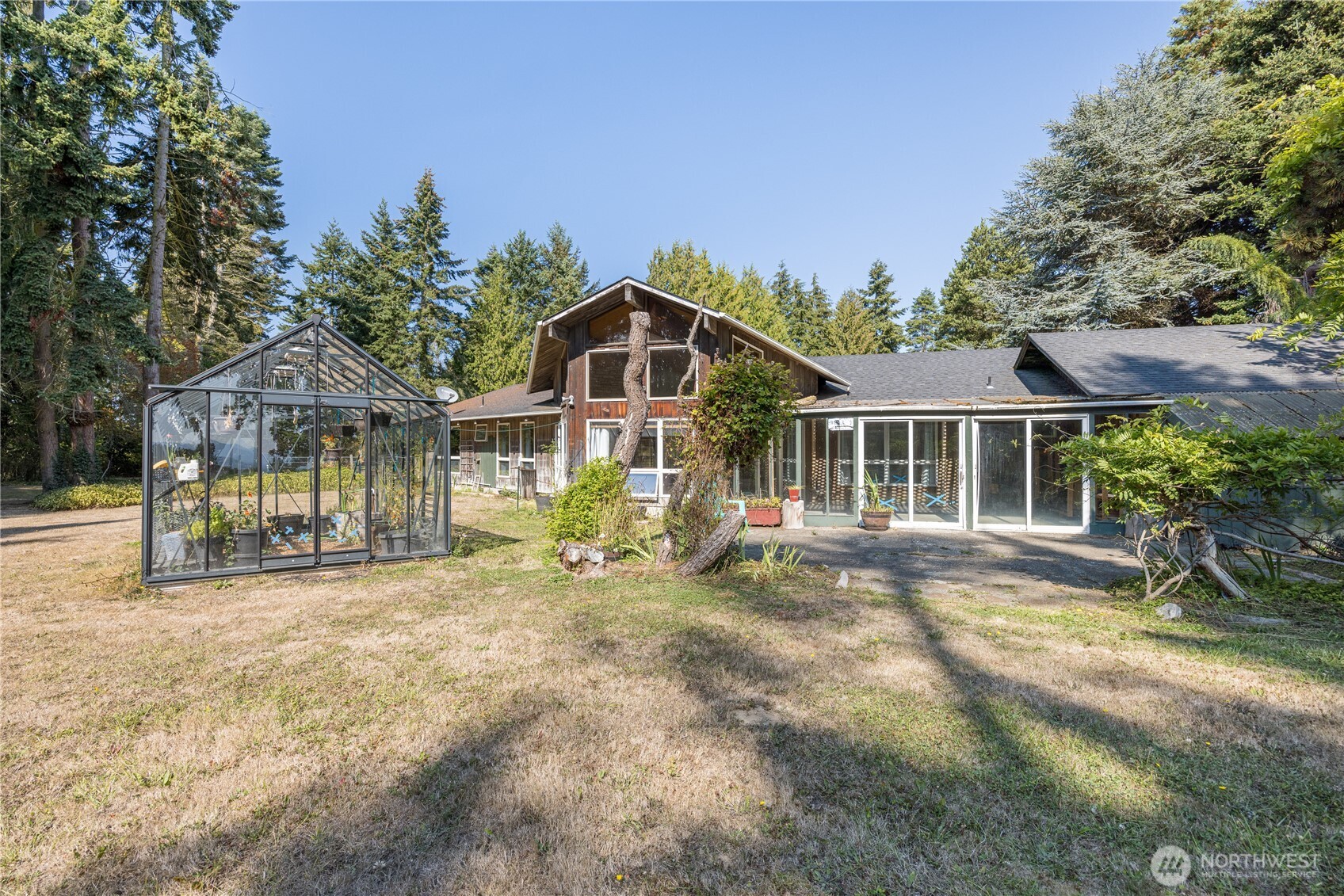 1175 Cameron Road Sequim, WA 98382 - Photo 34 of 39 a view of a house with backyard porch and sitting area
