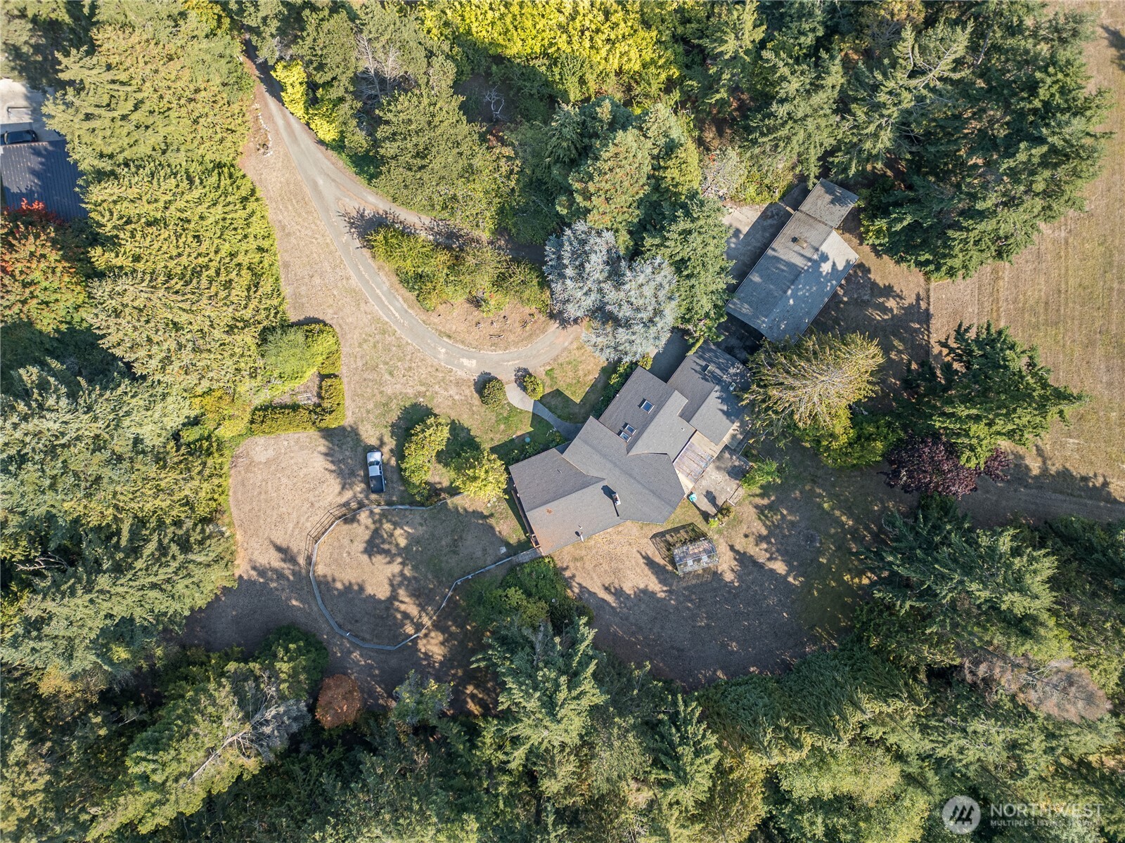 1175 Cameron Road Sequim, WA 98382 - Photo 4 of 39 an aerial view of residential house with outdoor space and trees all around