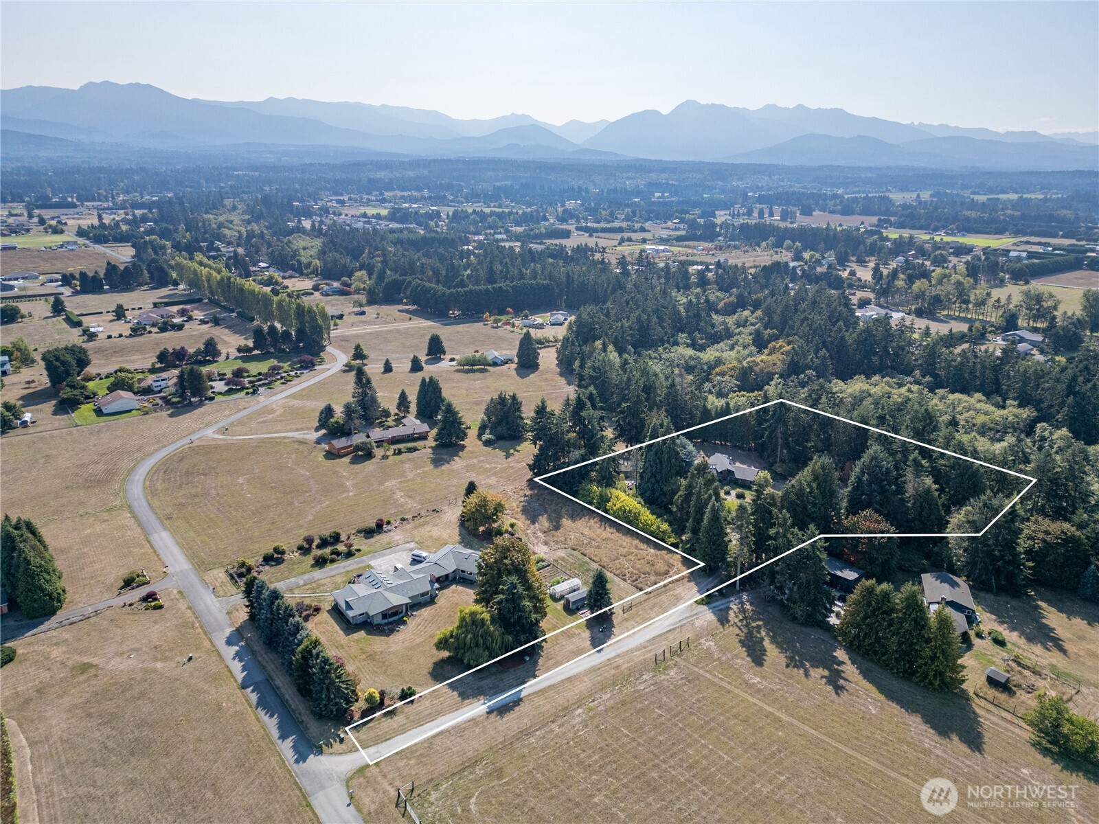 1175 Cameron Road Sequim, WA 98382 - Photo 7 of 39 an aerial view of a house with a garden