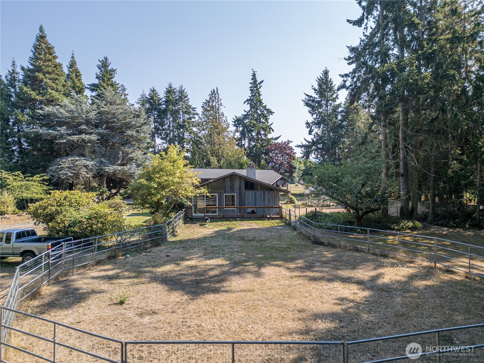 1175 Cameron Road Sequim, WA 98382 - Photo 9 of 39 a view of a yard in front of a house with large trees