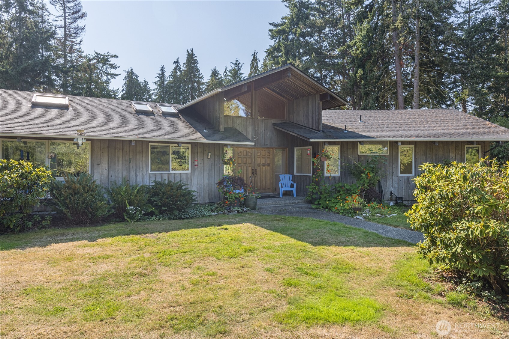 1175 Cameron Road Sequim, WA 98382 - Photo 10 of 39 a front view of a house with a yard and trees