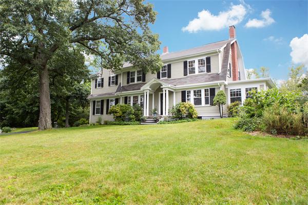 281 Glen Road Weston, MA 02493 - Photo 1 of 18 a front view of a house with a garden