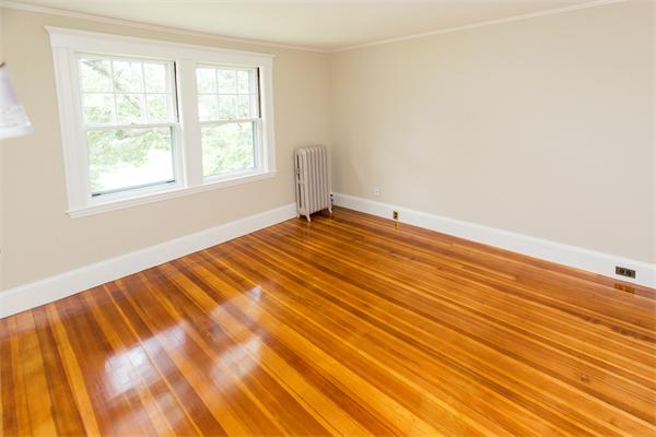 281 Glen Road Weston, MA 02493 - Photo 11 of 18 a view of an empty room with wooden floor and a window