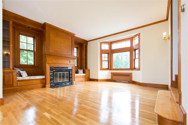 281 Glen Road Weston, MA 02493 - Photo 3 of 18 a view of an empty room with a fireplace and a window