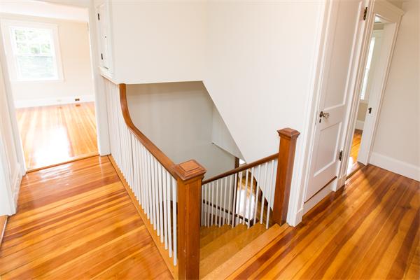 281 Glen Road Weston, MA 02493 - Photo 9 of 18 a view of a staircase with wooden floor and door