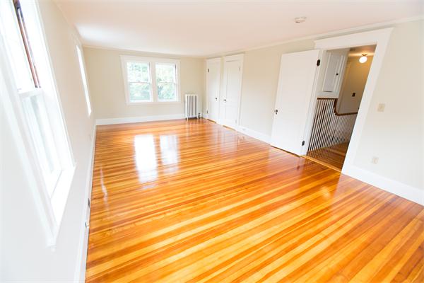 281 Glen Road Weston, MA 02493 - Photo 10 of 18 a view of empty room with wooden floor and fan