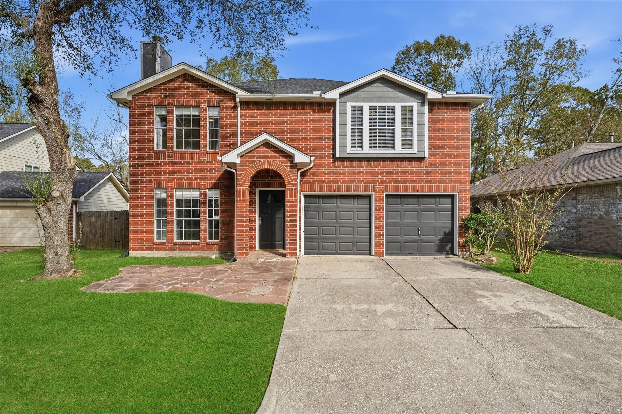 18385 Ten Oaks Court Porter, TX 77365 - Photo 1 of 31 front view of a house with a yard