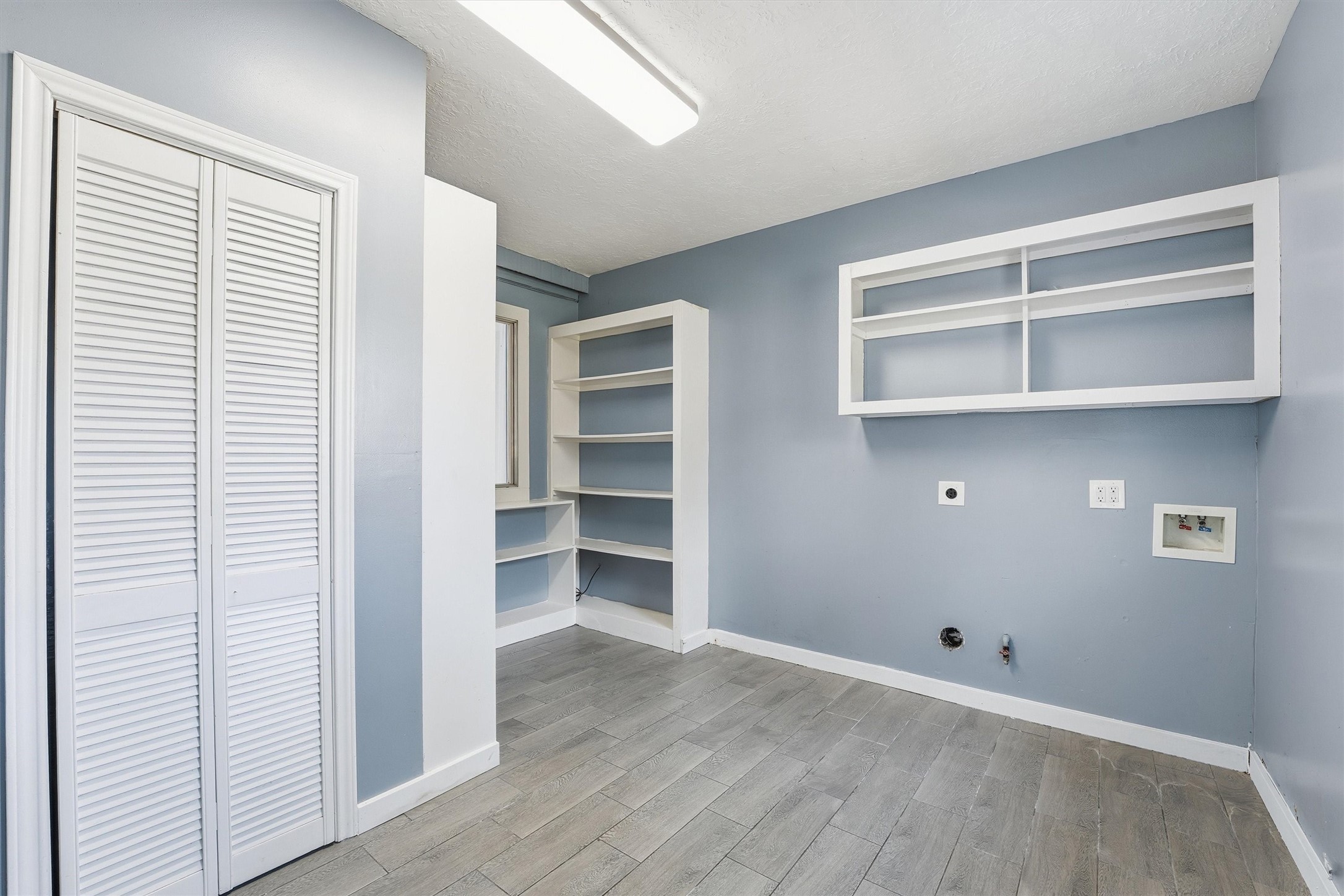 18385 Ten Oaks Court Porter, TX 77365 - Photo 12 of 31 a view of walk in closet with empty racks