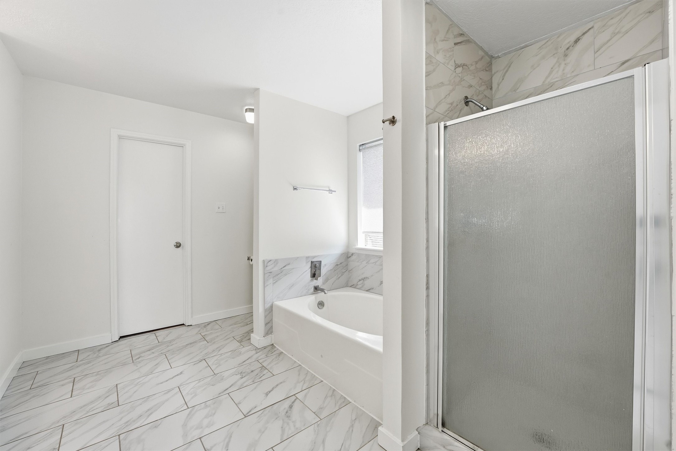 18385 Ten Oaks Court Porter, TX 77365 - Photo 19 of 31 a bathroom with a bathtub and a shower