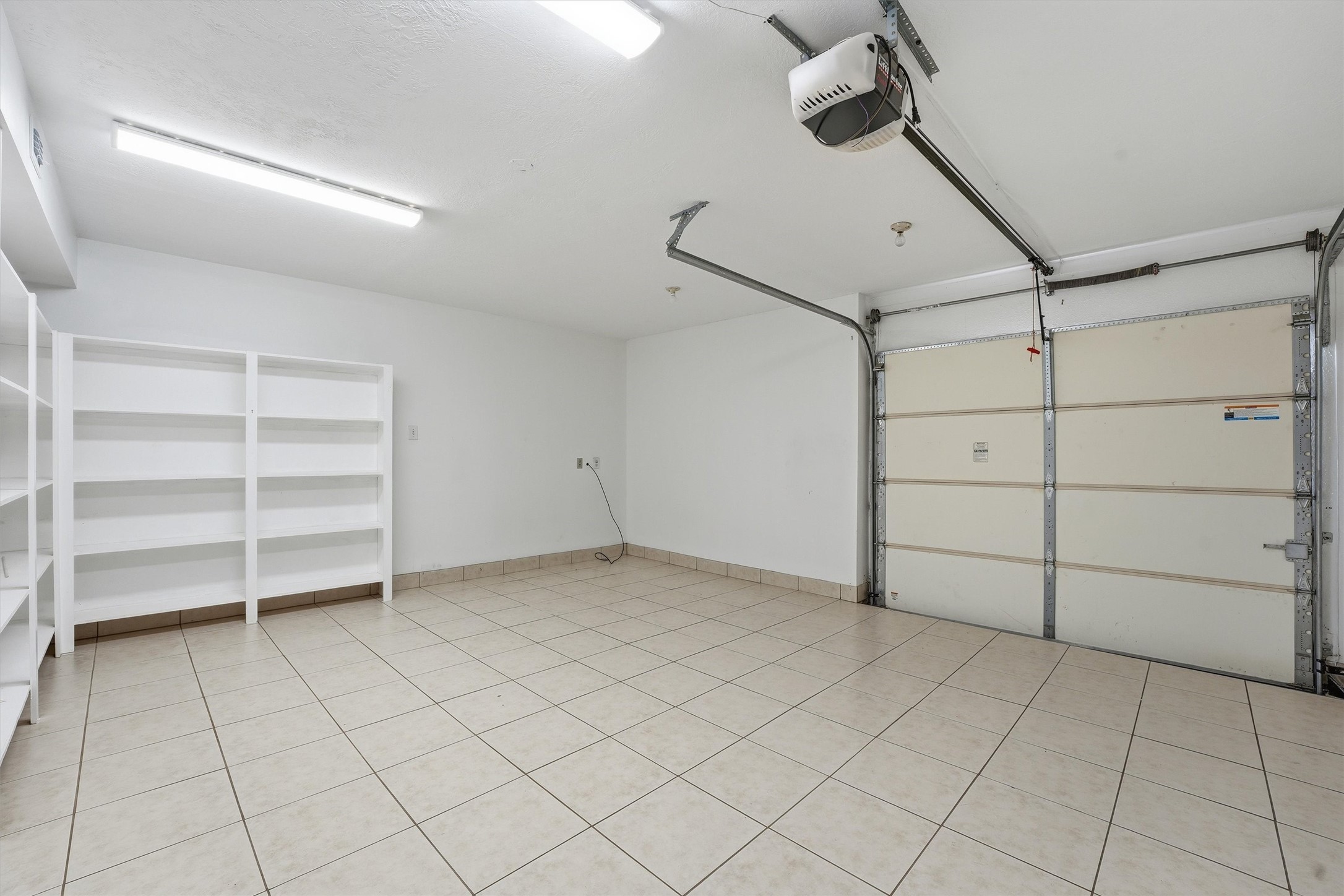 18385 Ten Oaks Court Porter, TX 77365 - Photo 23 of 31 a view of a room and racks on the wall