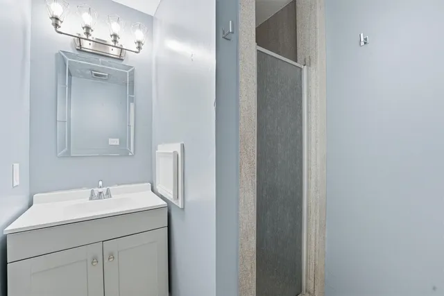 a bathroom with a sink and a mirror