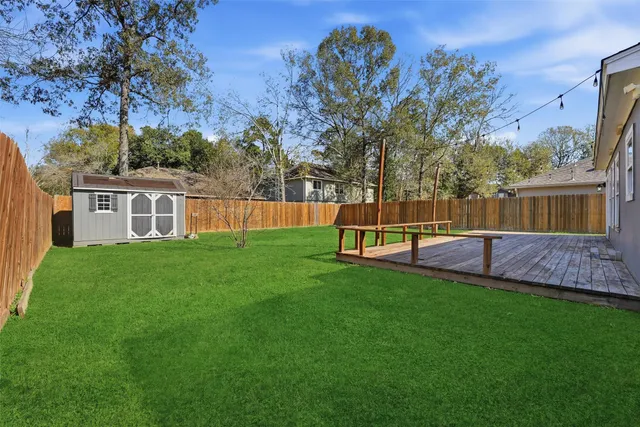 a view of a backyard with a small cabin