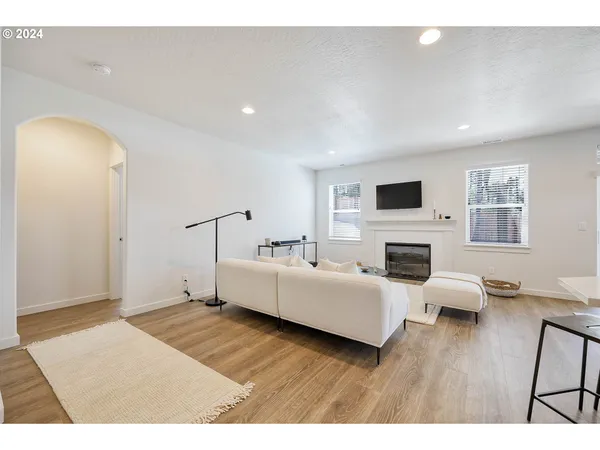 a living room with furniture fireplace and flat screen tv