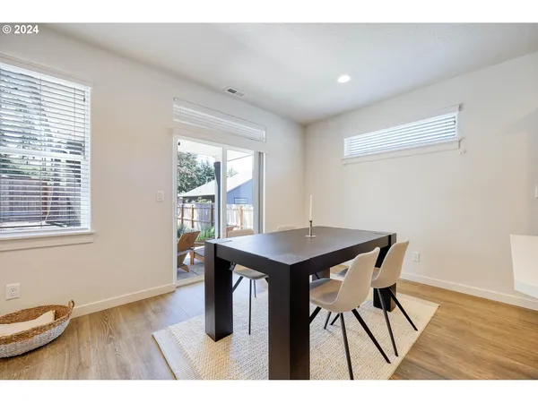 a view of a room with furniture window and wooden floor