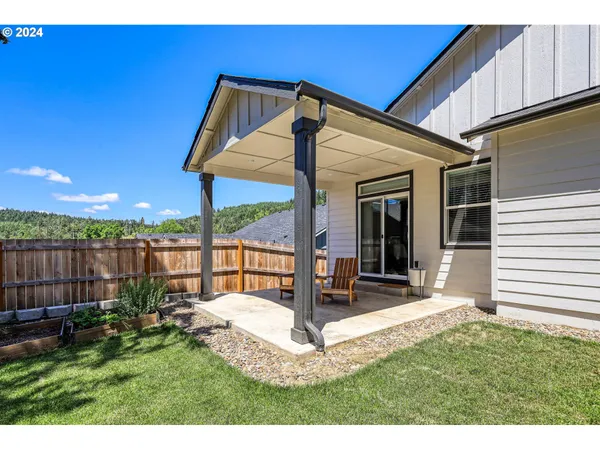 a view of a two chairs in the patio